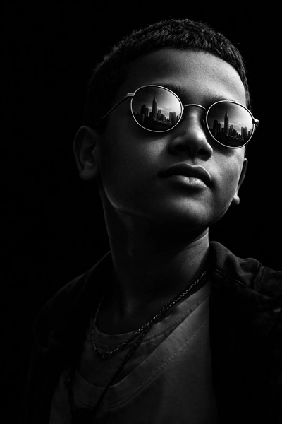 Dramatic, ultra-realistic close-up in black and white with high-contrast cinematic lighting from the